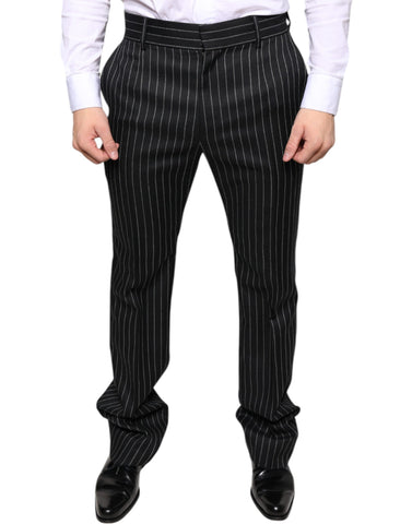 Black striped skinny men's dress pants by Dolce & Gabbana, tailored fit with sleek design and subtle stripe pattern.