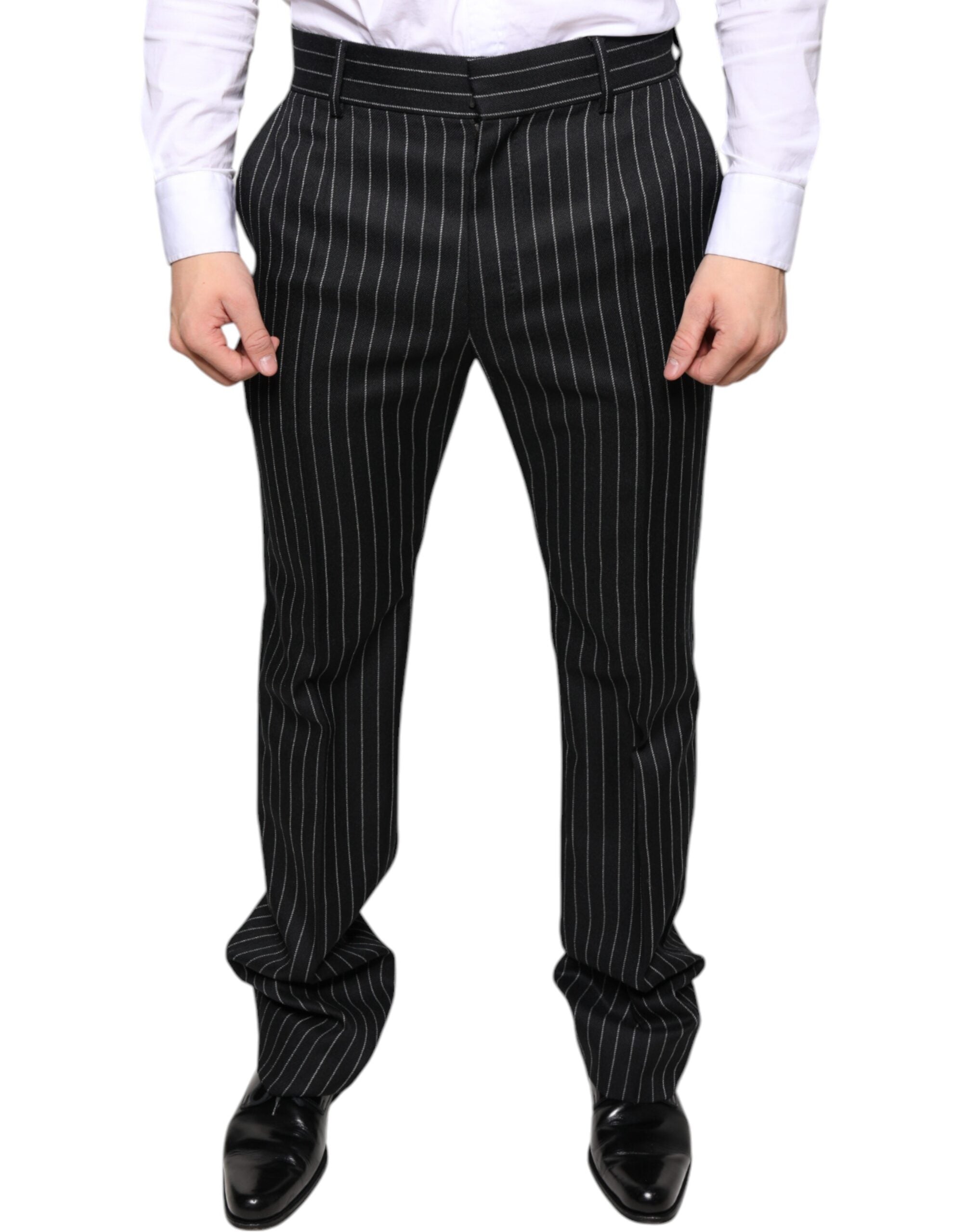 Slim fit black striped men's dress pants by Dolce & Gabbana featuring a tailored style and classic stripe pattern.