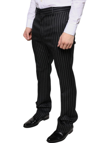 Black striped skinny men's dress pants by Dolce & Gabbana, featuring a tailored fit and sleek design.