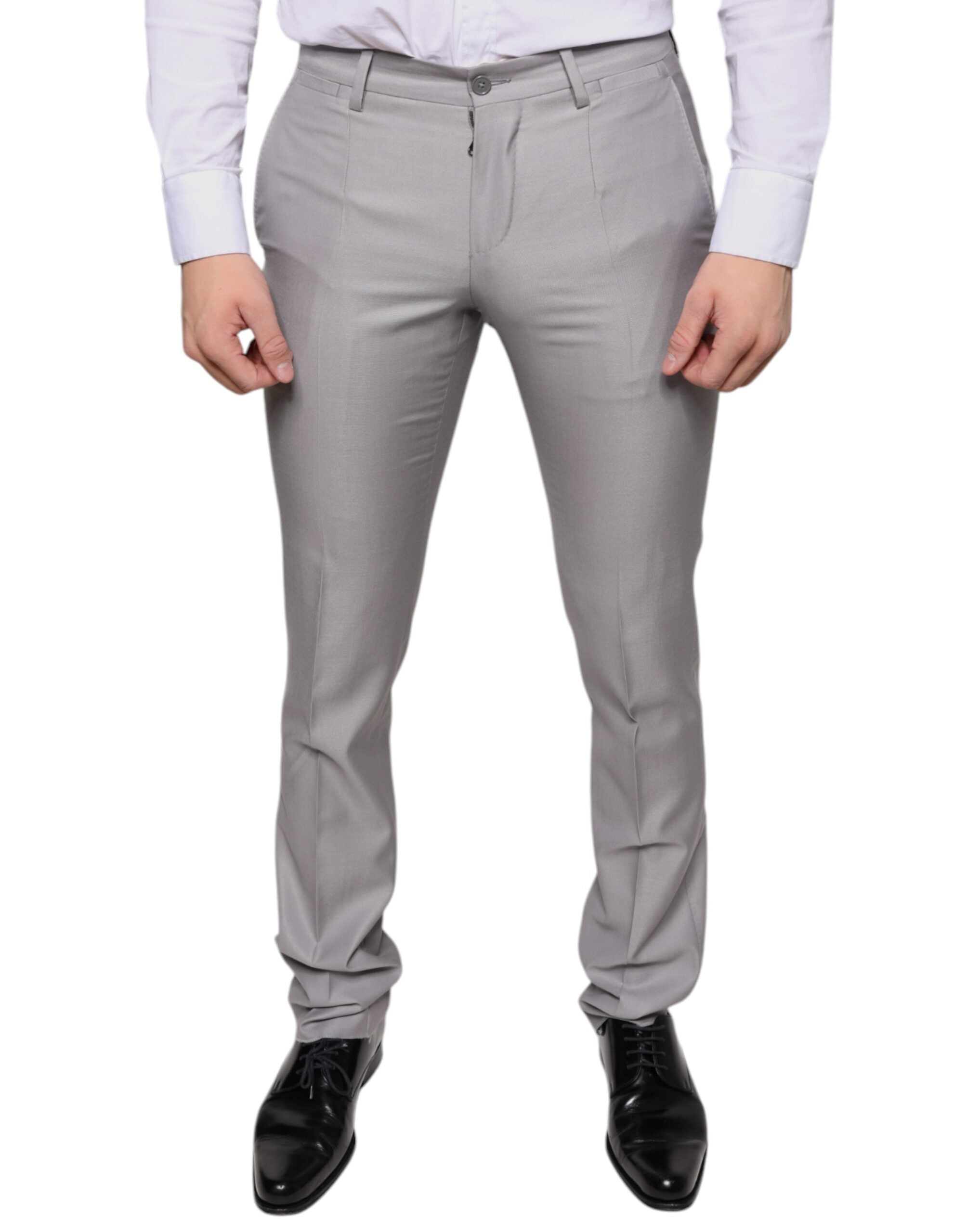 Light gray wool dress pants by Dolce & Gabbana, tailored fit with classic crease front, side pockets, and belt loops.