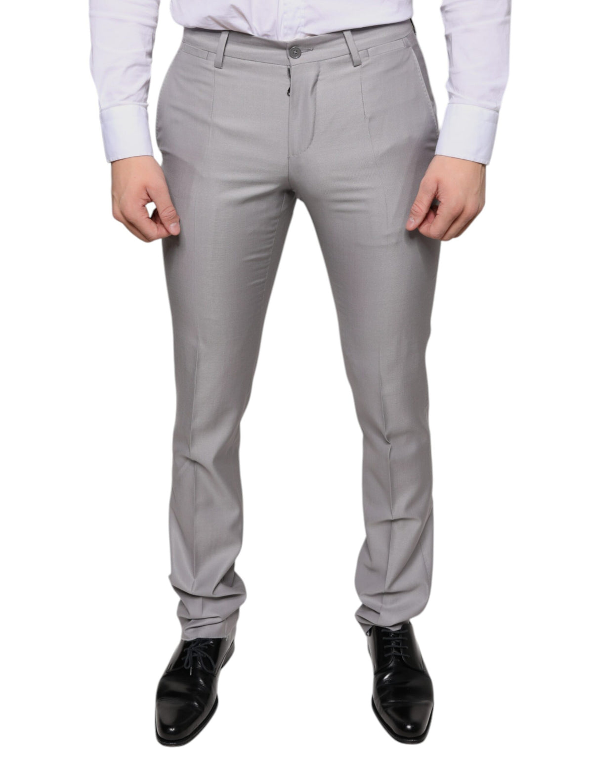 Light gray wool dress pants by Dolce & Gabbana, tailored fit with classic crease front, side pockets, and belt loops.