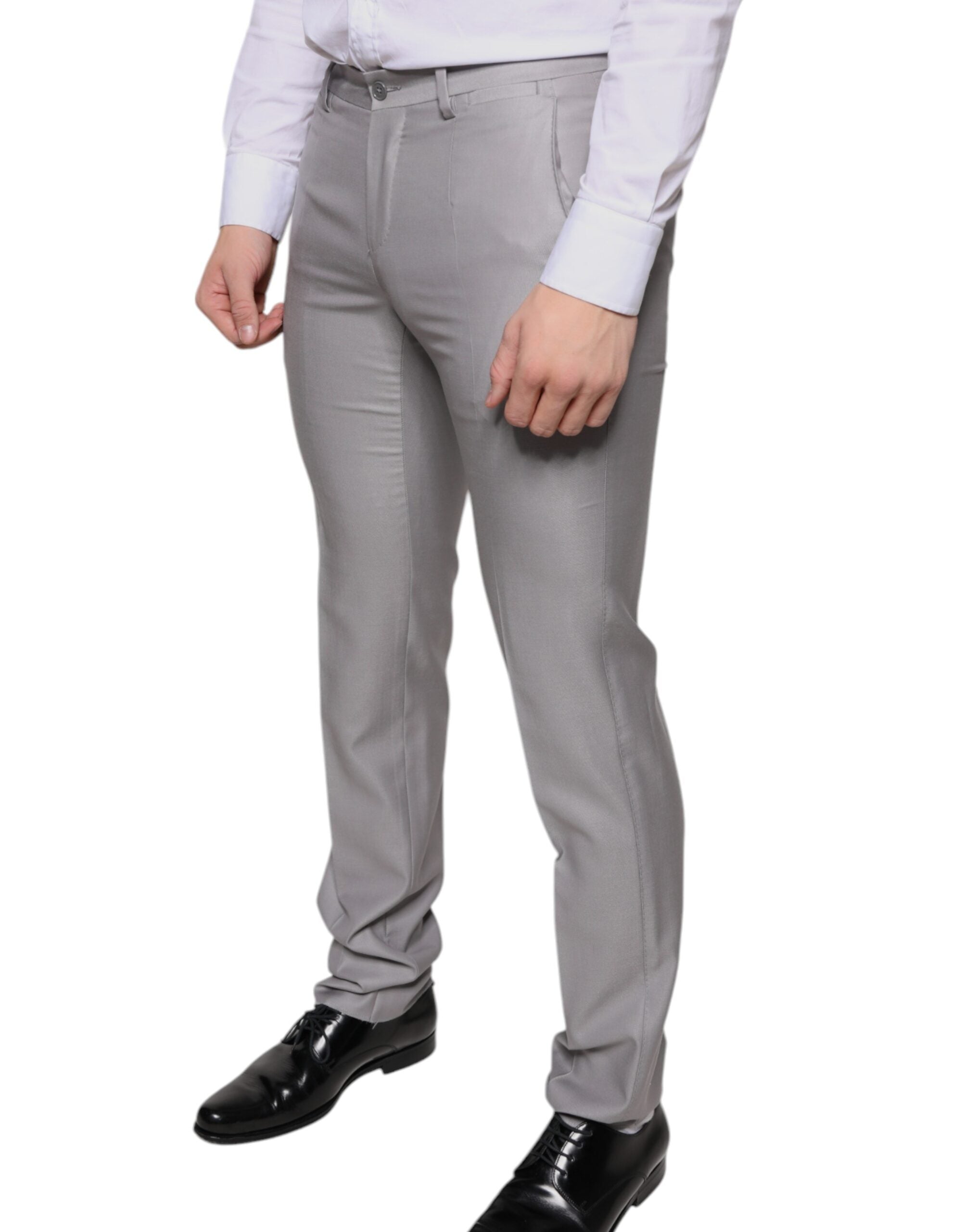 Light gray wool dress pants by Dolce & Gabbana, tailored fit with classic waistband and front pockets, suitable for formal occasions.
