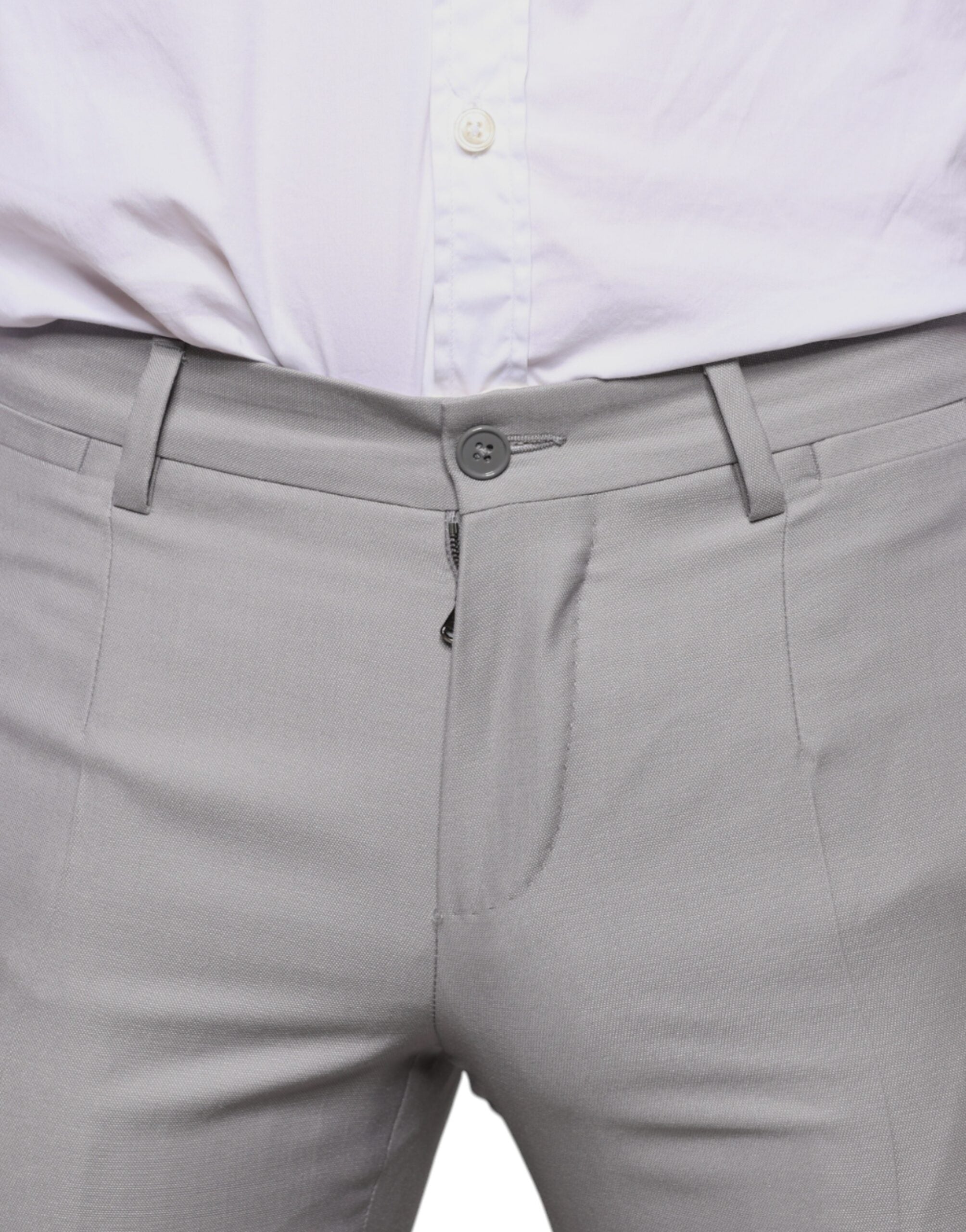 Light gray wool dress pants by Dolce & Gabbana, tailored fit with a classic waistband and creased front for a sophisticated look.