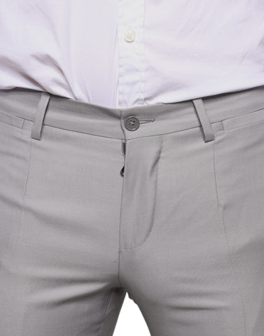 Light gray wool dress pants by Dolce & Gabbana, tailored fit with a classic waistband and creased front for a sophisticated look.