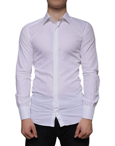White cotton men's dress shirt by Dolce & Gabbana, formal gold-toned buttons, classic fit, shown on hanger.