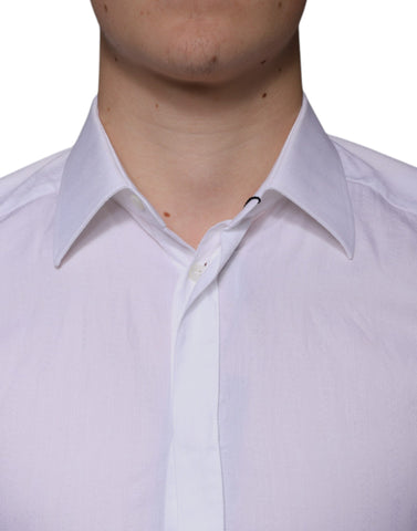 White cotton men's dress shirt by Dolce & Gabbana, gold accents, formal shirt with classic collar and button-down front.