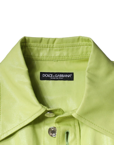 Green cotton collared men's button-down shirt by Dolce & Gabbana, displayed on a hanger with visible front buttons and collar detail.