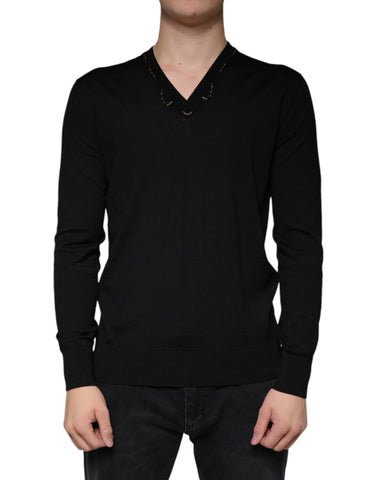 Black embellished V-neck pullover sweater by Dolce & Gabbana featuring intricate beadwork and a soft knit texture.