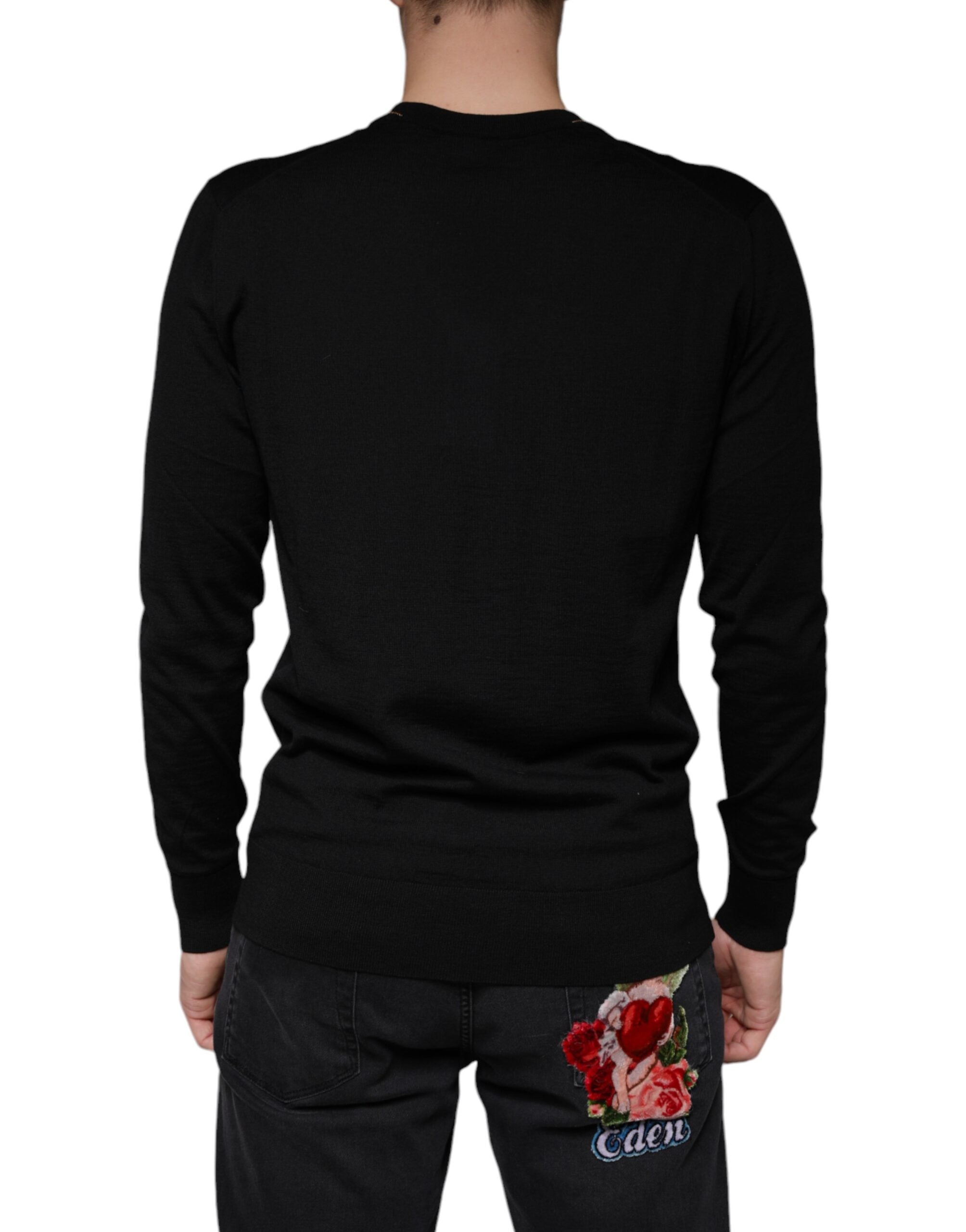 Black embellished V-neck pullover sweater by Dolce & Gabbana featuring intricate detailing and a stylish fit.