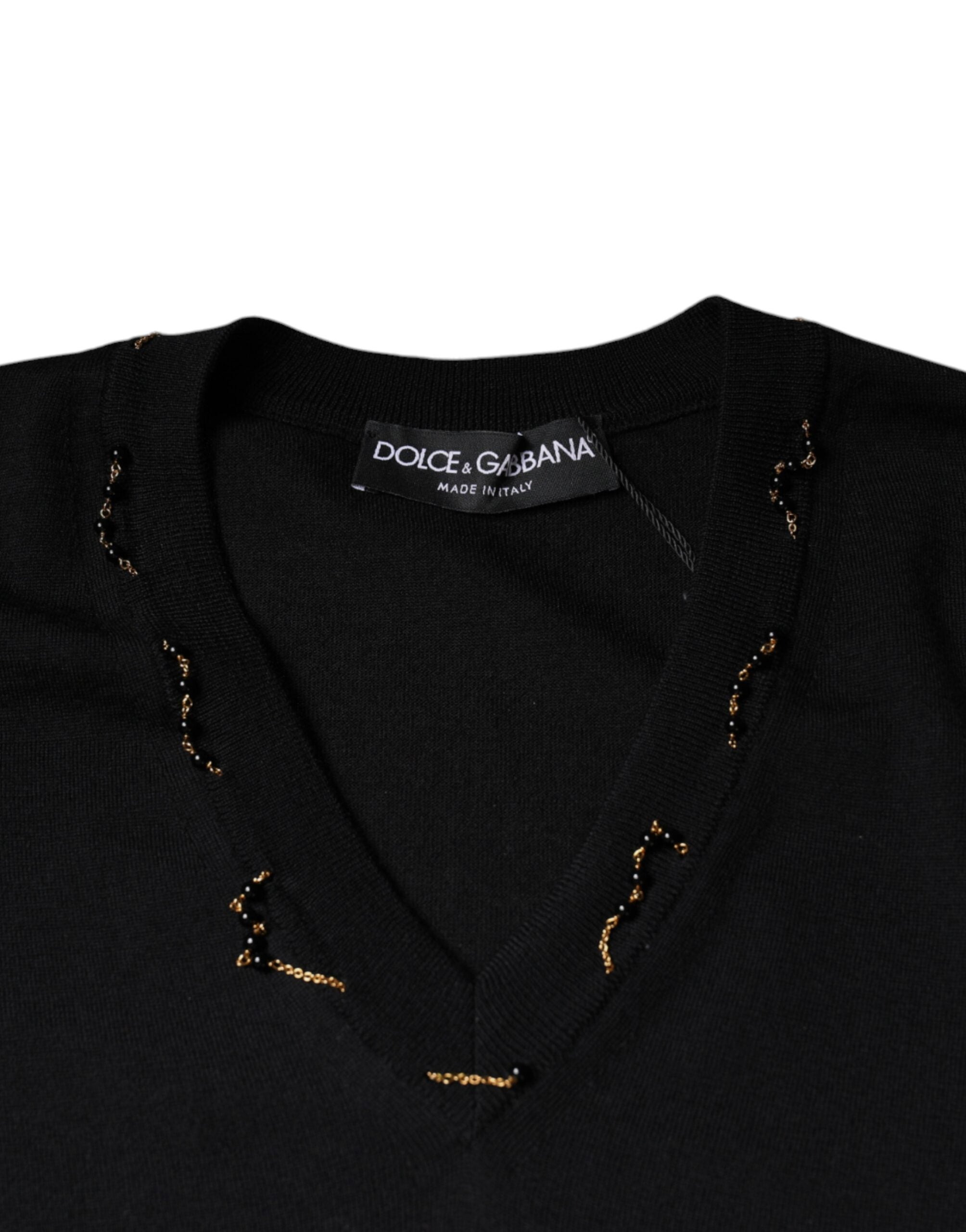 Black embellished V-neck pullover sweater by Dolce & Gabbana, featuring intricate embellishments and a stylish V-neck design.