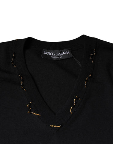 Black embellished V-neck pullover sweater by Dolce & Gabbana, featuring intricate embellishments and a stylish V-neck design.