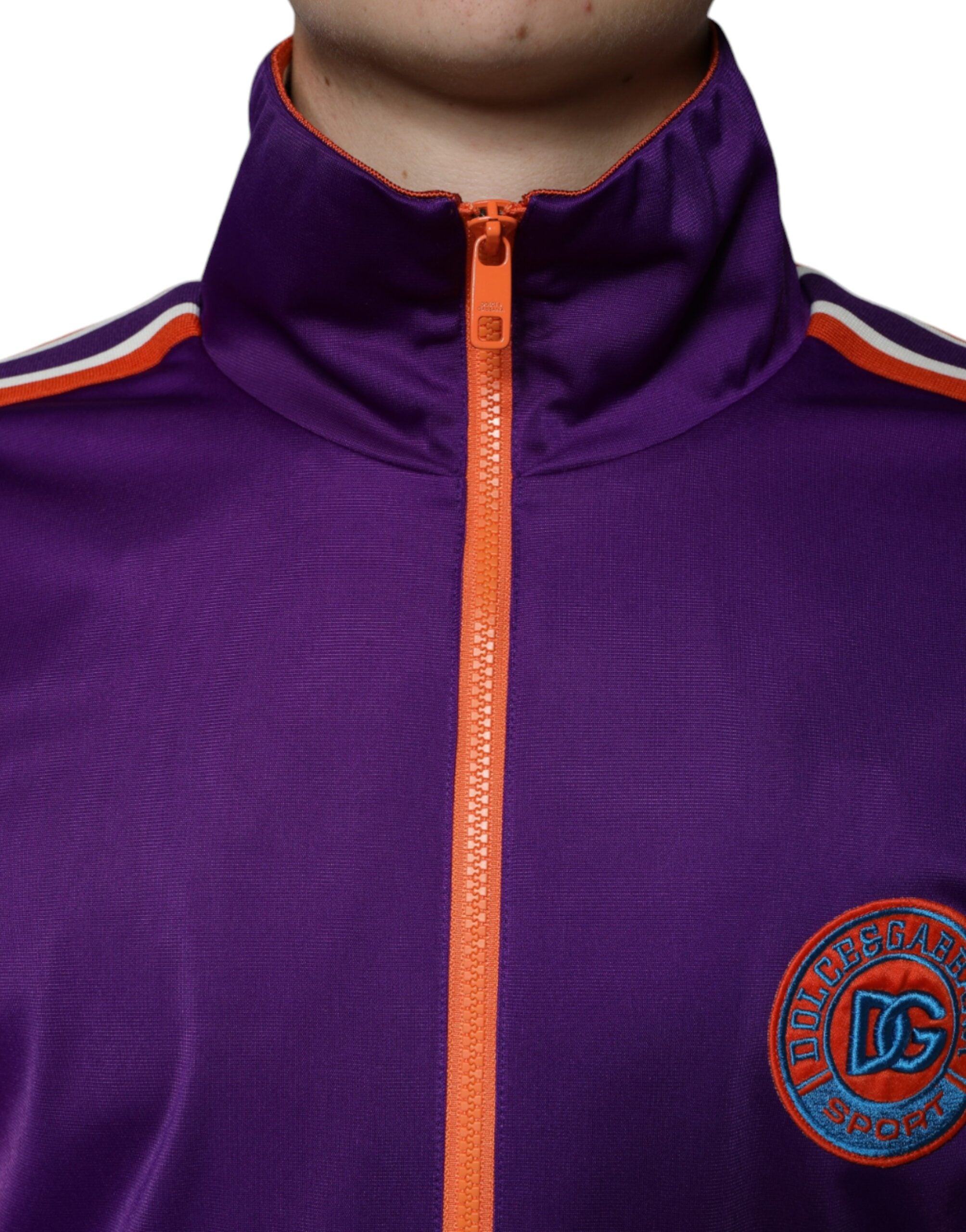 Purple polyester full-zip long sleeve sweater by Dolce & Gabbana, shown on a model with a close-up view of the fabric and zipper details.
