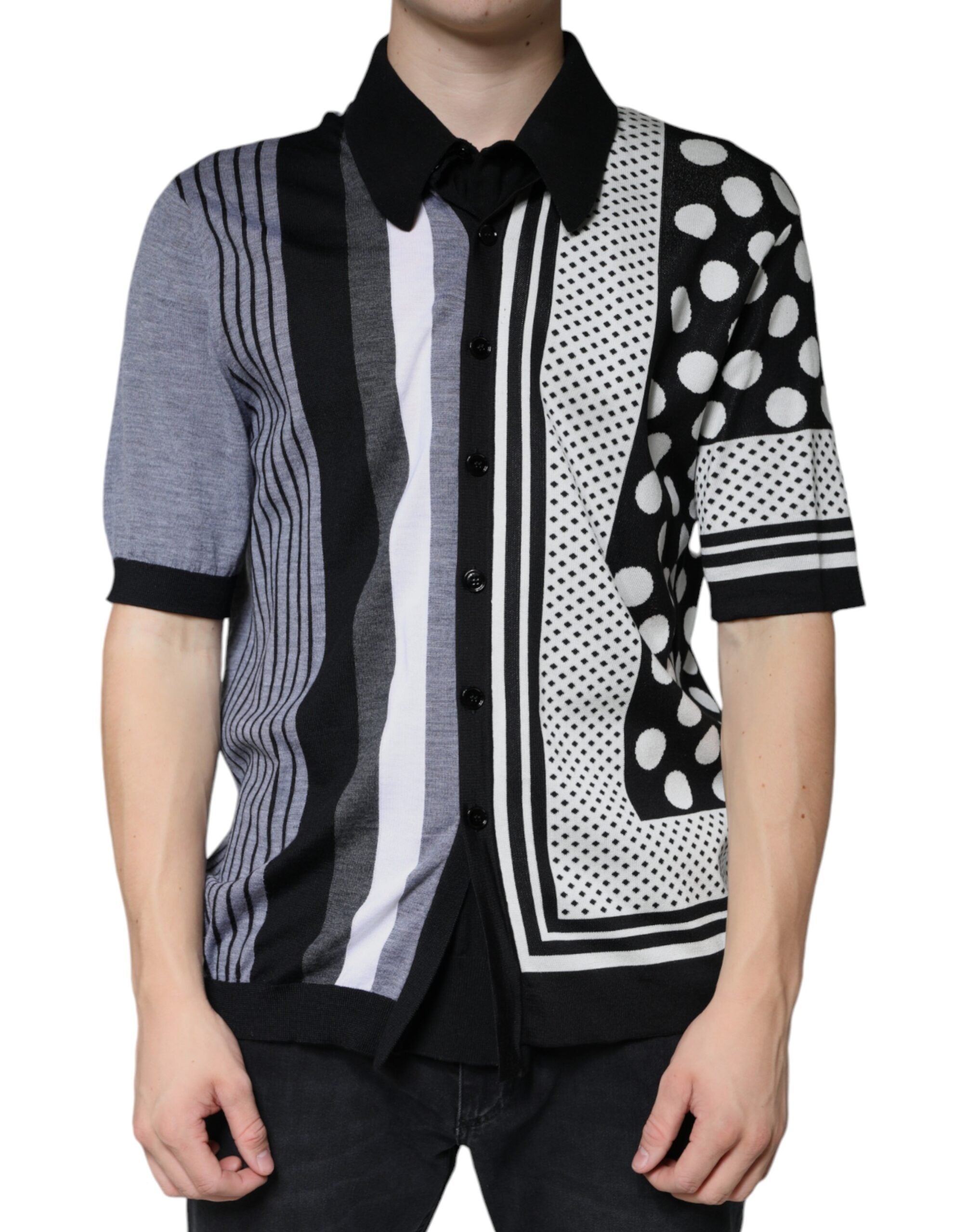 Black and white polka dot collared polo shirt by Dolce & Gabbana, featuring a classic polo design with a pointed collar.