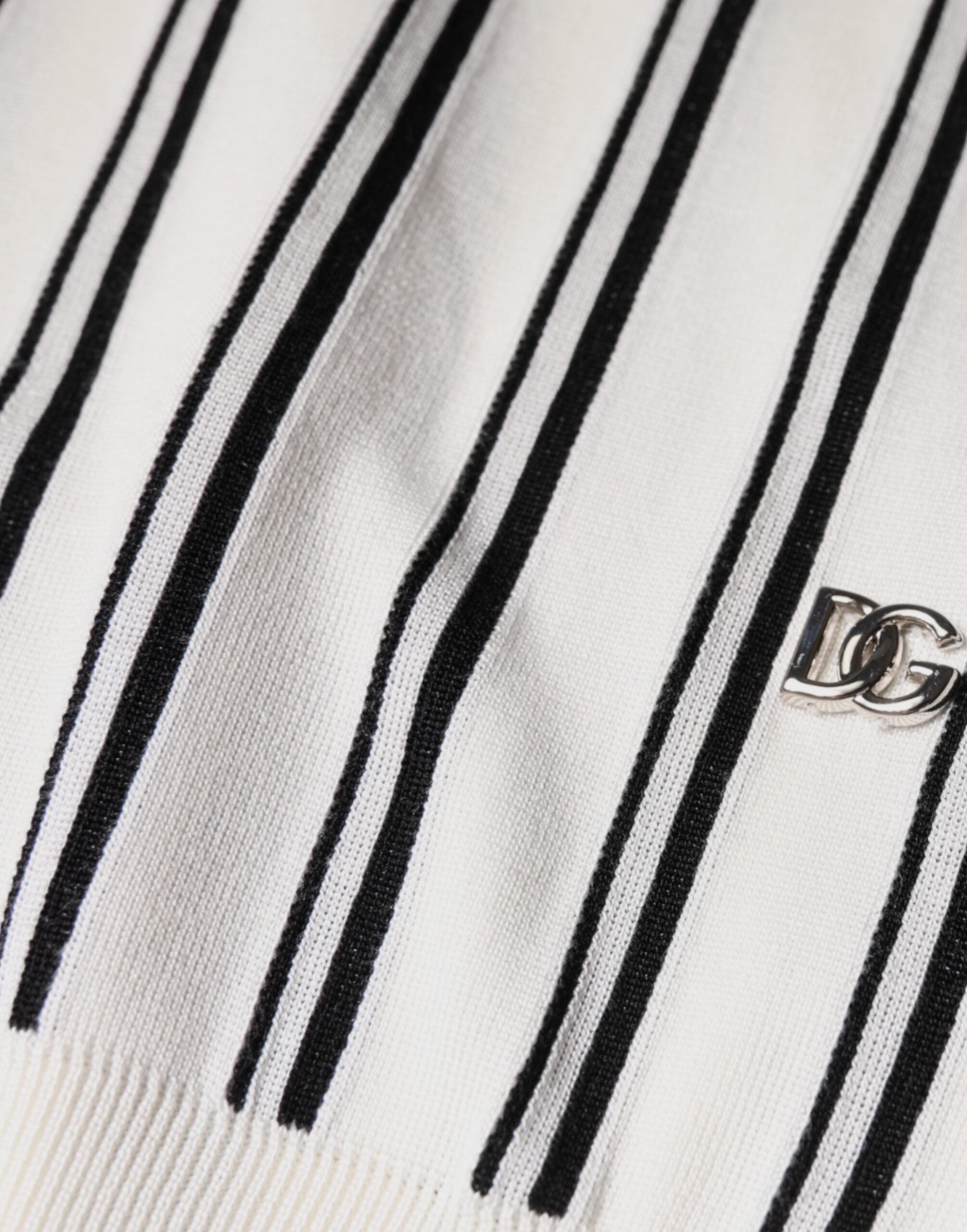 White and black striped Dolce & Gabbana short sleeve polo shirt with a classic collar and subtle logo detail.