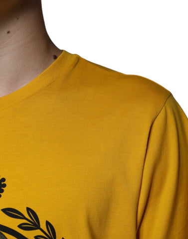 White Dolce & Gabbana short sleeve T-shirt with yellow logo print on front, casual and stylish men's or women's clothing.