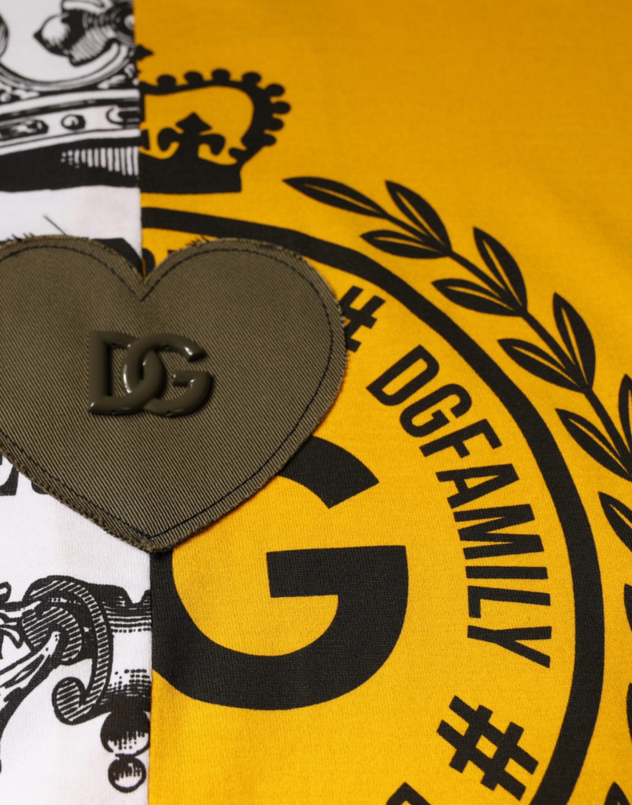 White Dolce & Gabbana short sleeve T-shirt with yellow logo print, casual crew neck design, front view showing logo detail.