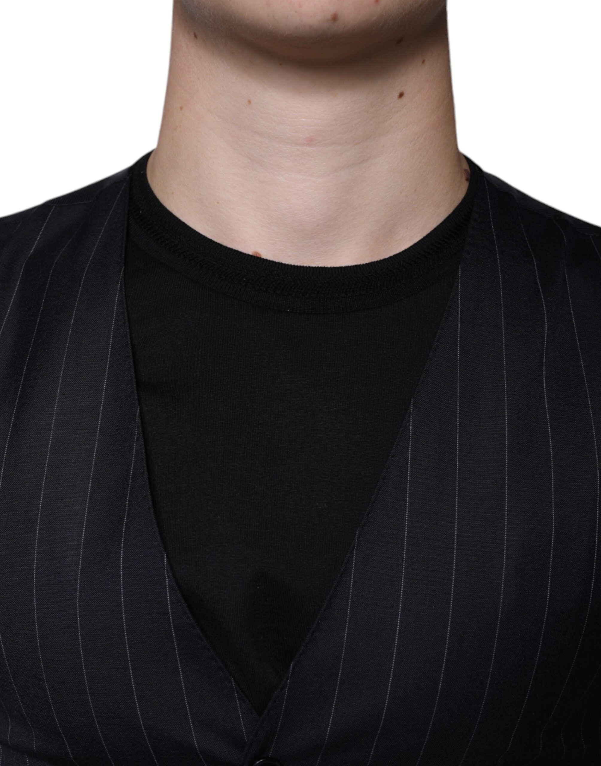 Black leather waistcoat dress by Dolce & Gabbana, formal vest style with sleek, fitted design and classic collar detail.