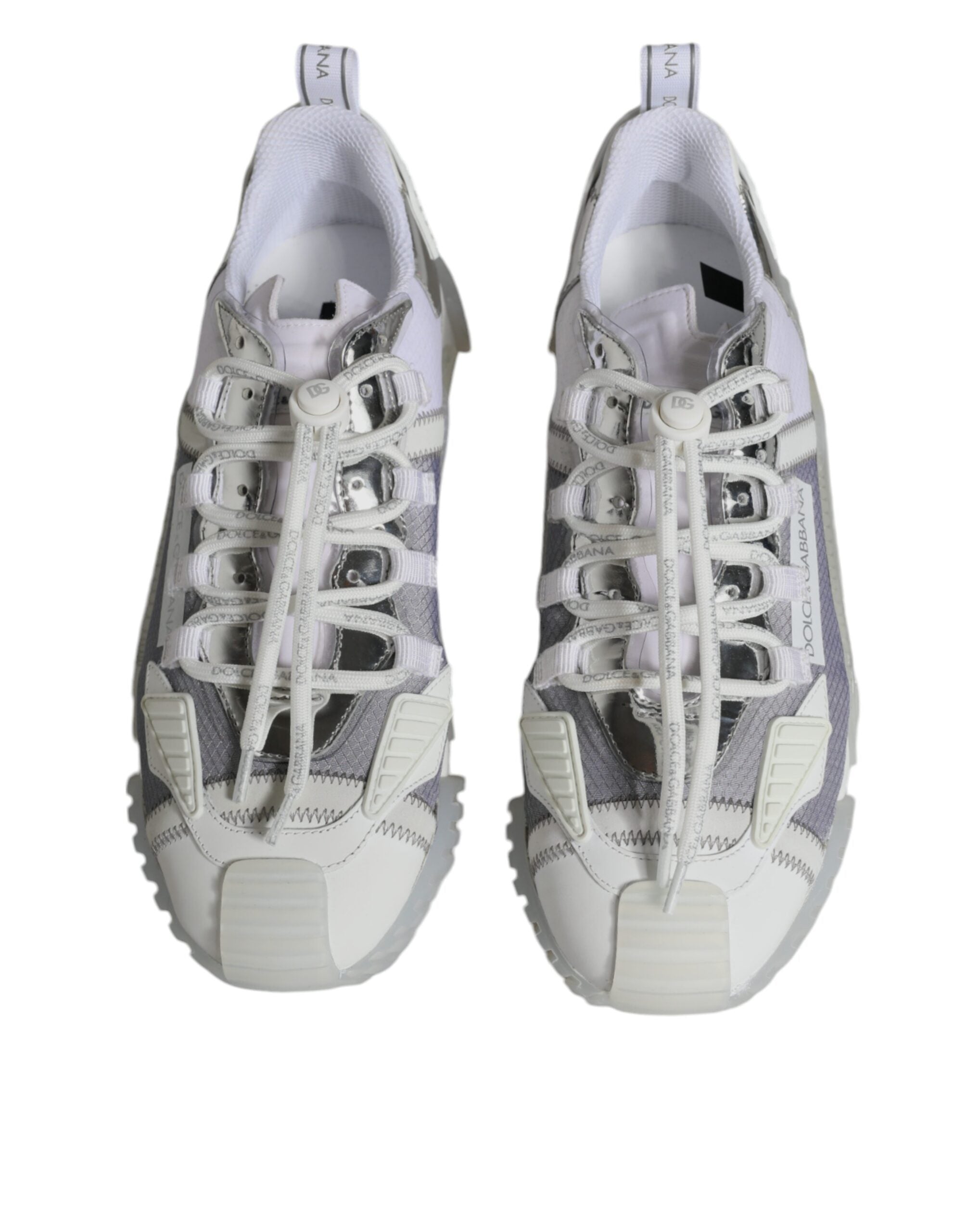 White silver low-top NS1 sneakers by Dolce & Gabbana, featuring sleek design and stylish laces, on a plain background.