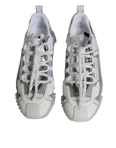 White silver low-top NS1 sneakers by Dolce & Gabbana, featuring sleek design and stylish laces, on a plain background.