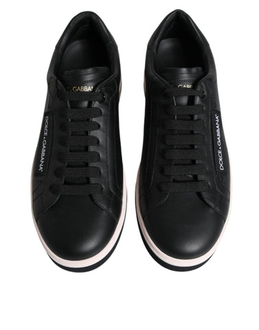 Black leather low-top men's sneakers by Dolce & Gabbana, featuring stylish design and white sole.