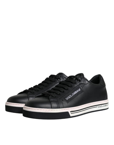Black leather low top men's sneakers by Dolce & Gabbana with sleek design and white rubber sole.