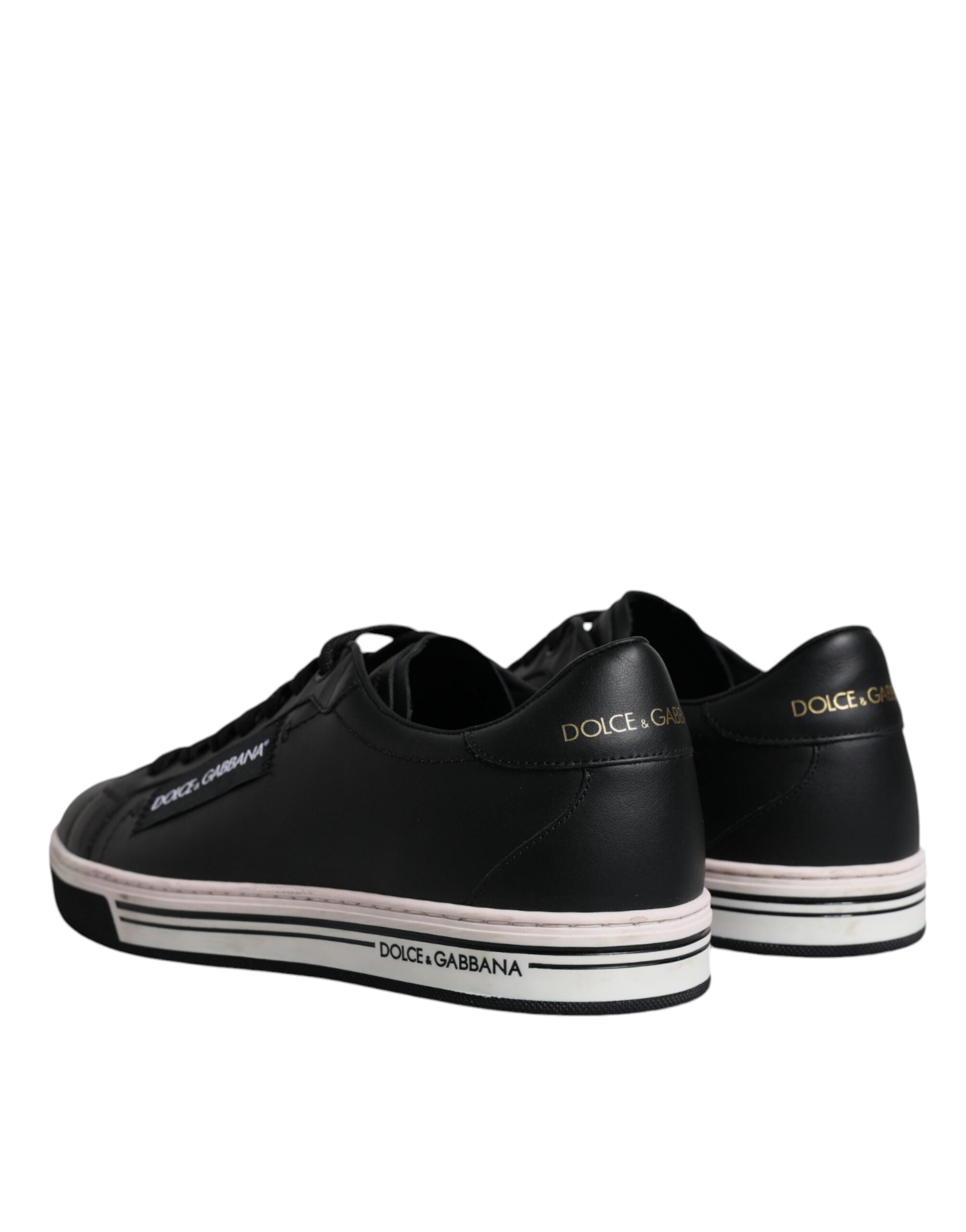 Black leather low top men's sneakers by Dolce & Gabbana, featuring sleek design and classic lace-up style.