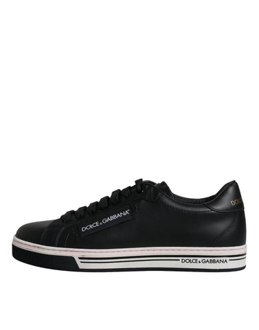 Black leather low-top men's sneakers by Dolce & Gabbana, featuring sleek design and white rubber soles.