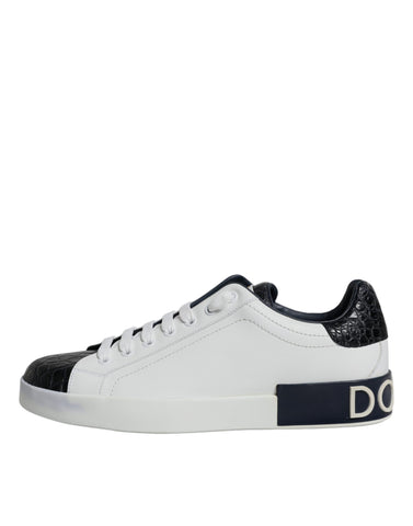 White leather Dolce & Gabbana Portofino sneakers with logo detail, showcasing sleek design and stylish casual footwear.