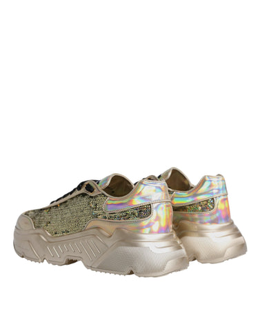 Gold sequin iridescent Daymaster sneakers by Dolce & Gabbana with shimmering sequins and sporty design on a white background.