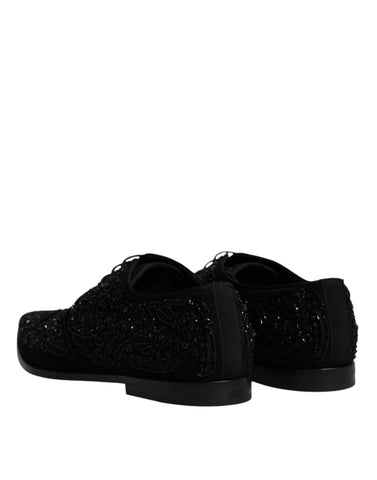Black embellished suede derby shoes by Dolce & Gabbana with decorative detailing and classic formal design.