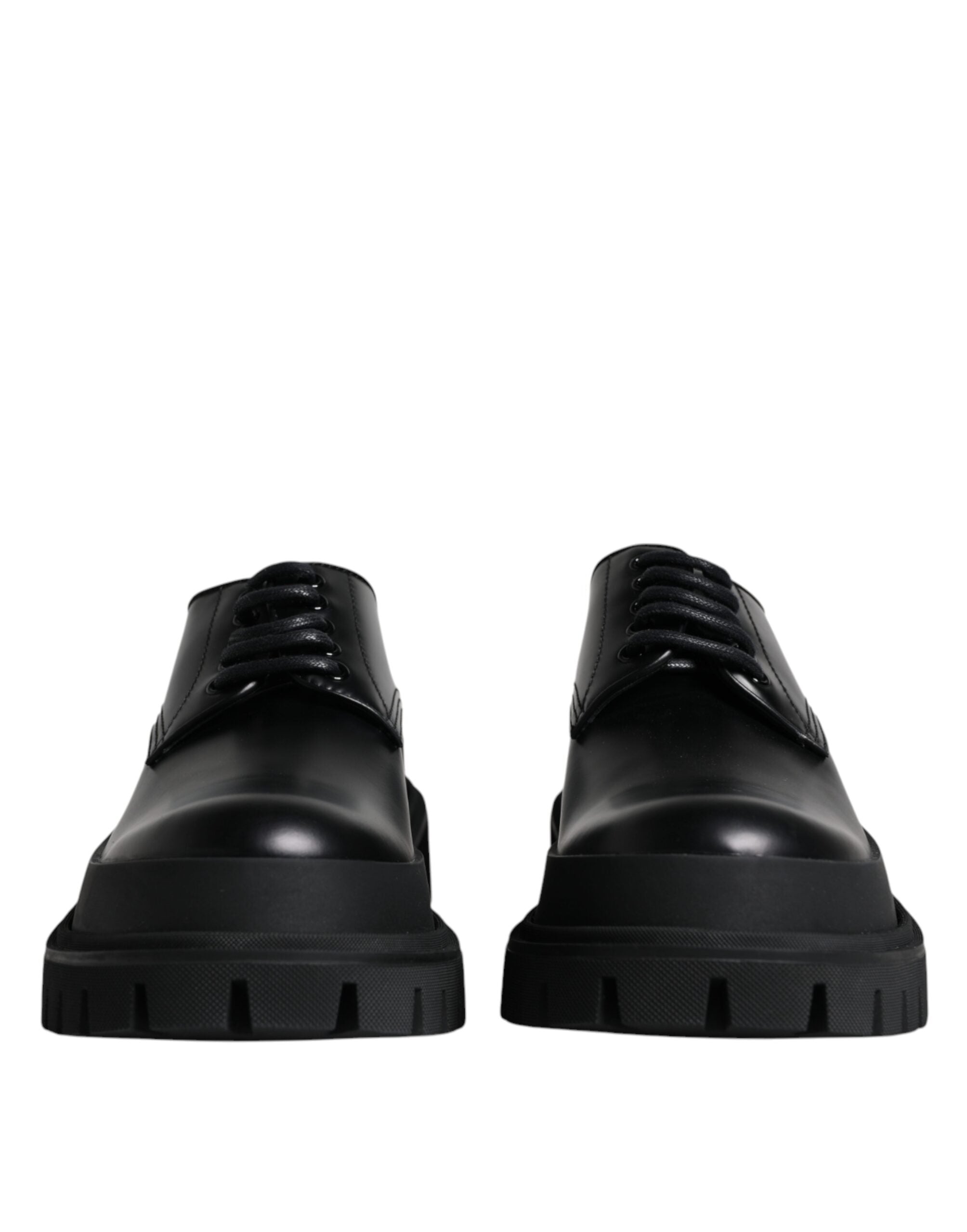 Black leather lace-up trekking dress shoes by Dolce & Gabbana, featuring sturdy soles and stylish design for outdoor and formal wear.