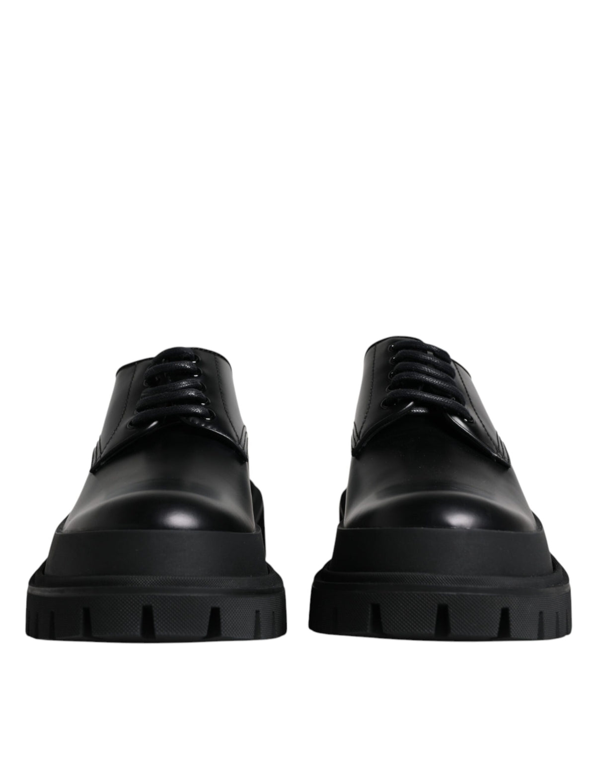Black leather lace-up trekking dress shoes by Dolce & Gabbana, featuring sturdy soles and stylish design for outdoor and formal wear.