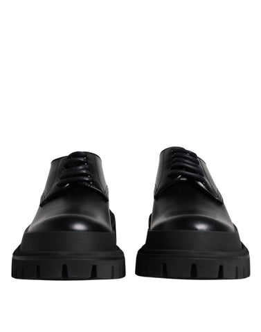 Black leather lace-up trekking dress shoes by Dolce & Gabbana, featuring sturdy soles and stylish design for outdoor and formal wear.