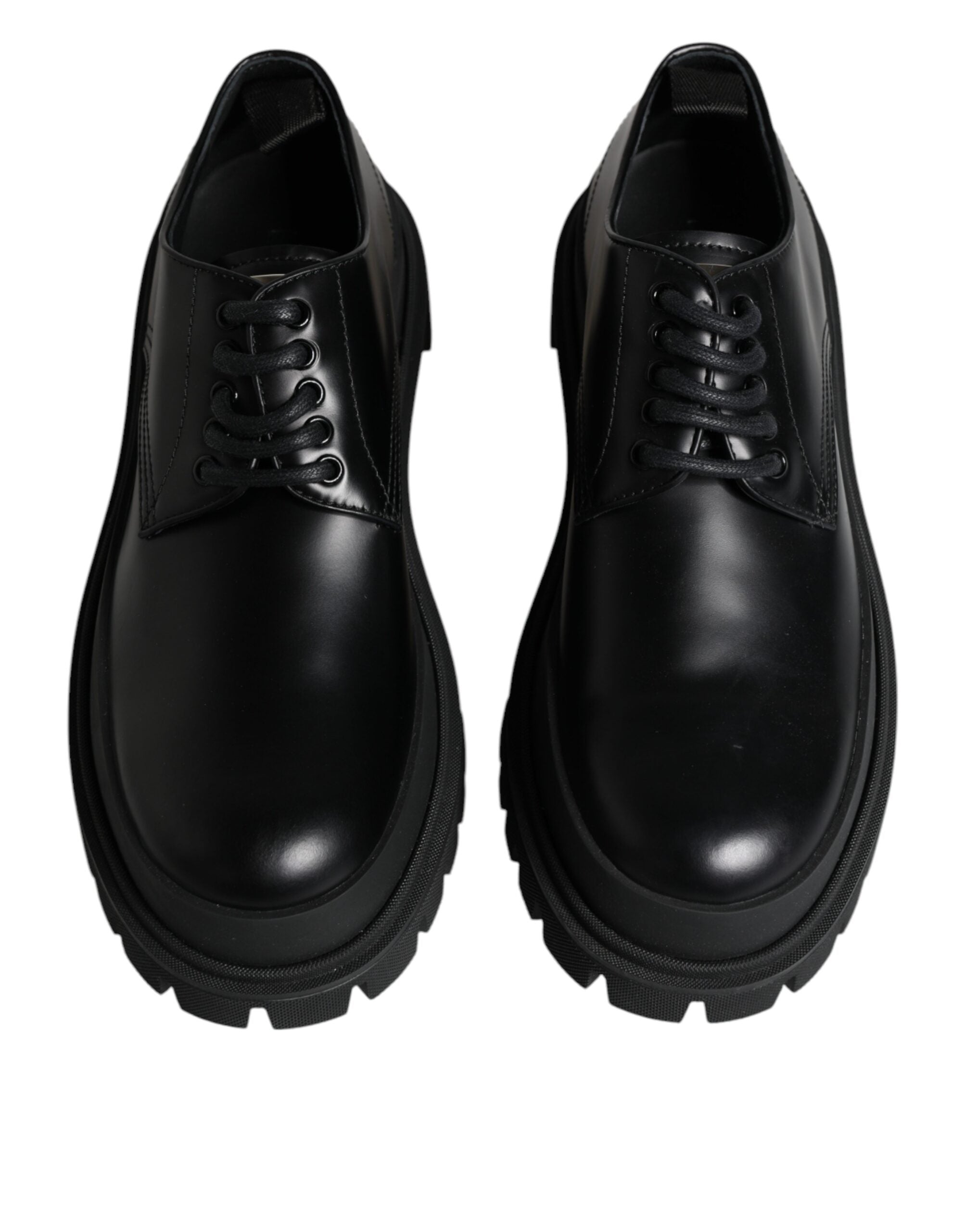 Black leather lace-up trekking dress shoes by Dolce & Gabbana with sturdy soles and sleek design.