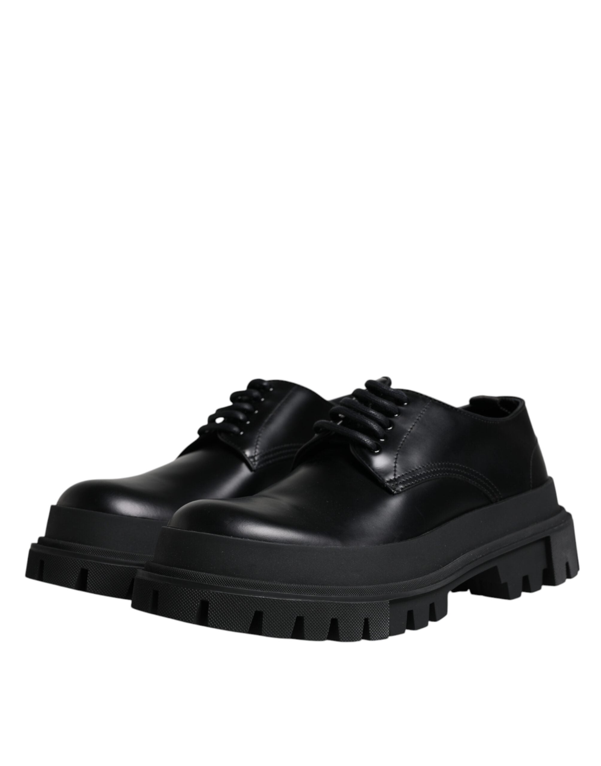 Black leather lace-up trekking dress shoes by Dolce & Gabbana, featuring sturdy soles and classic design.