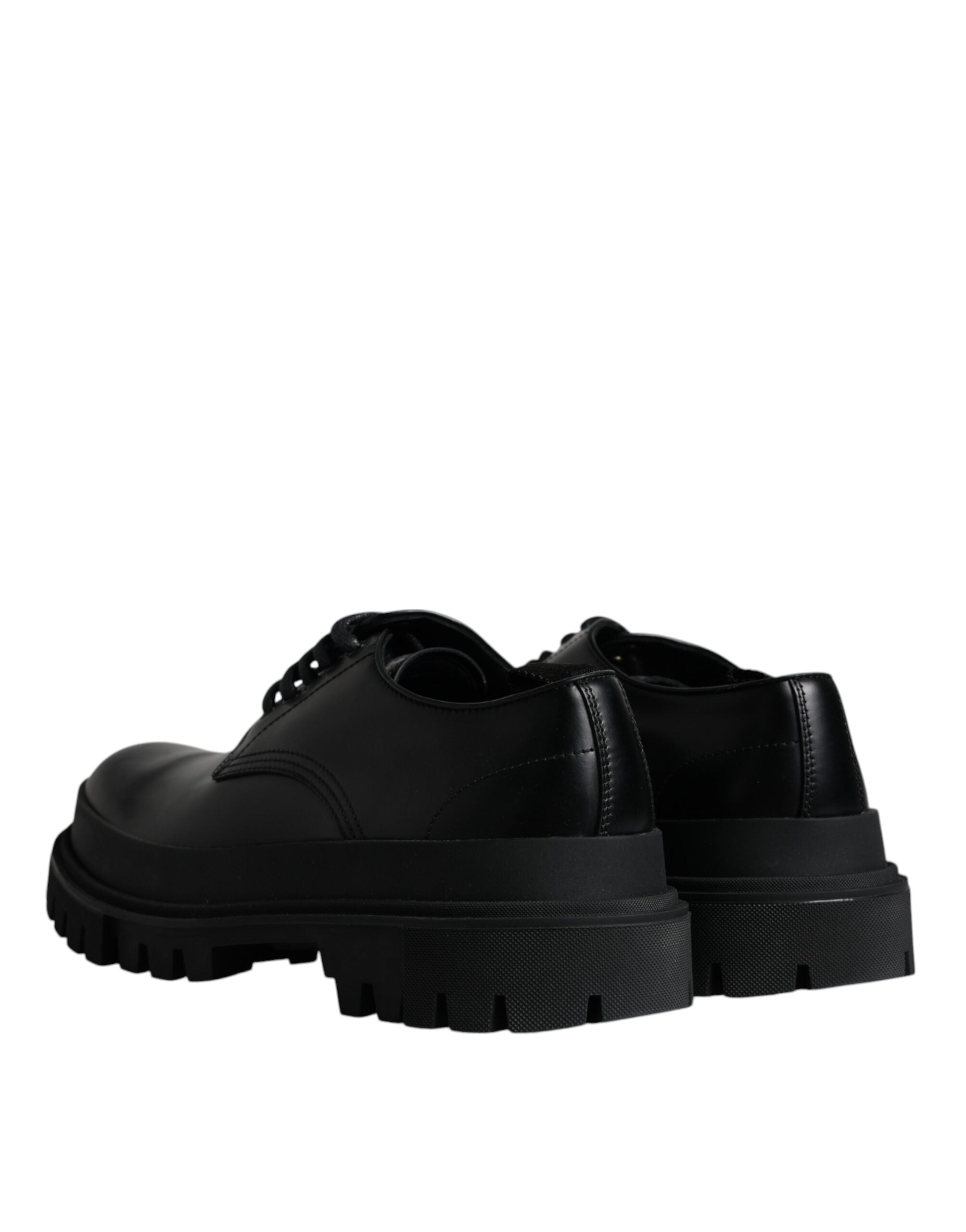 Black leather lace-up trekking dress shoes by Dolce & Gabbana, featuring sturdy soles and sleek design for stylish outdoor wear.