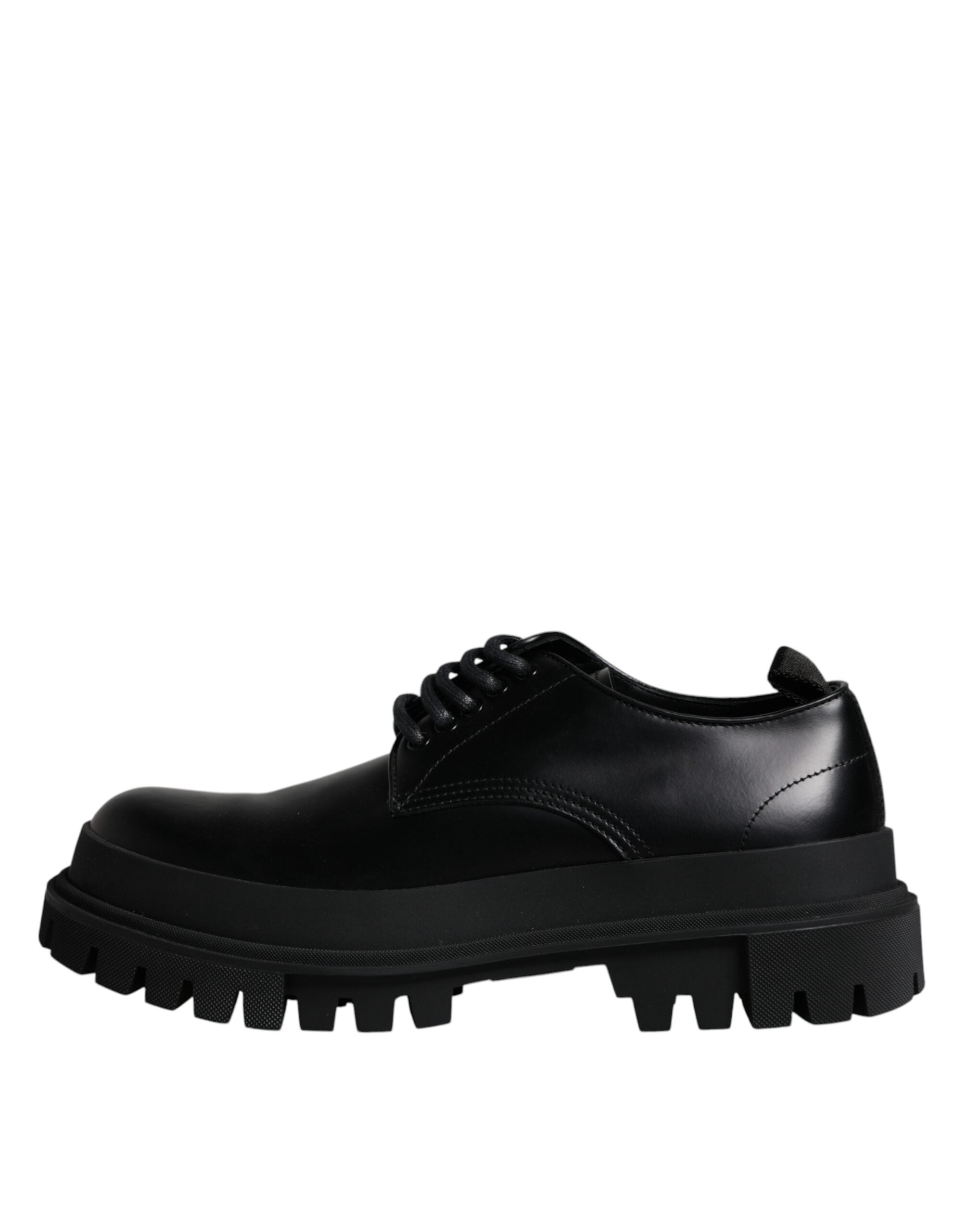 Black leather lace-up trekking dress shoes by Dolce & Gabbana, featuring sturdy soles and stylish design.