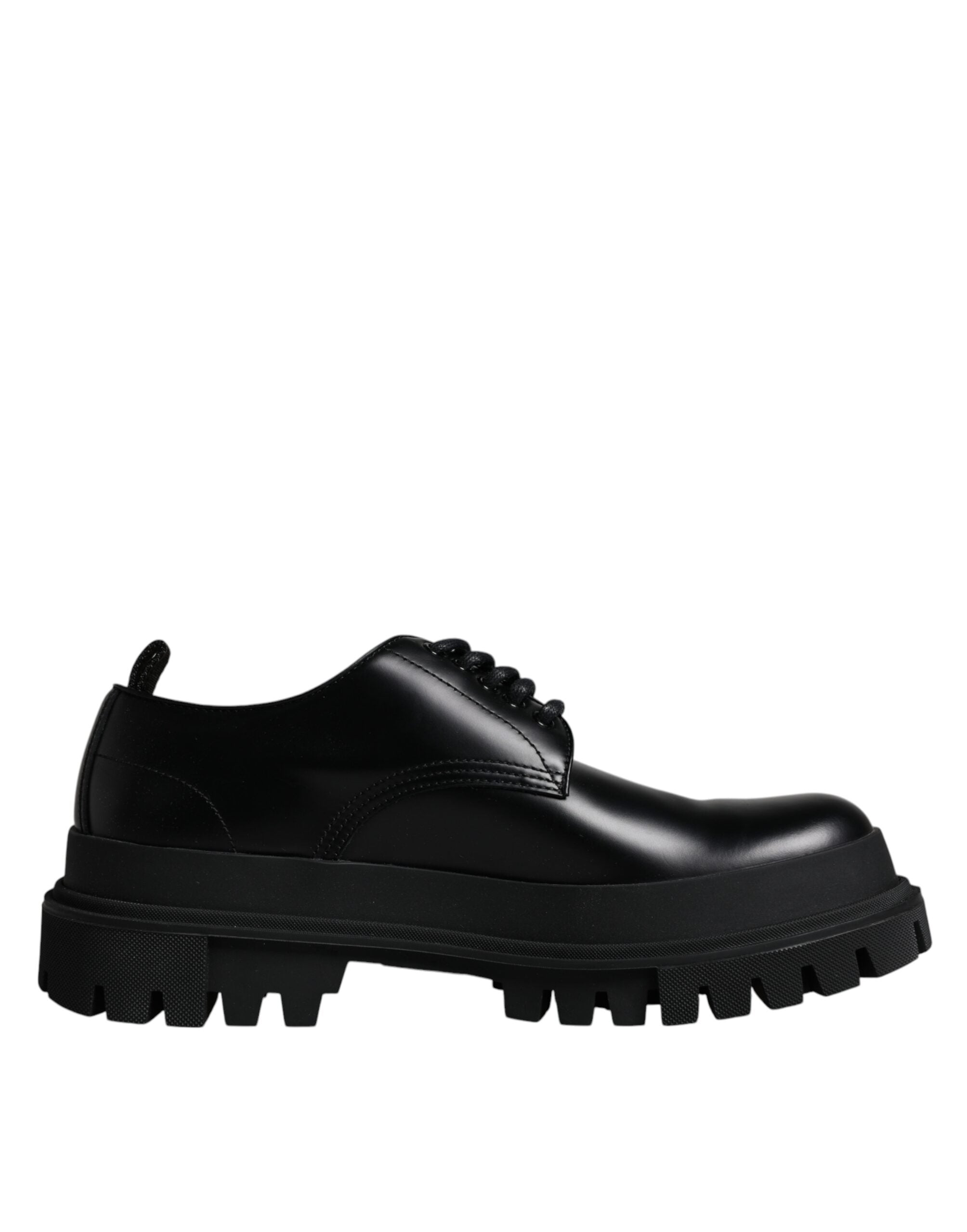 Black leather lace-up trekking dress shoes by Dolce & Gabbana, featuring sturdy soles and stylish design for outdoor elegance.