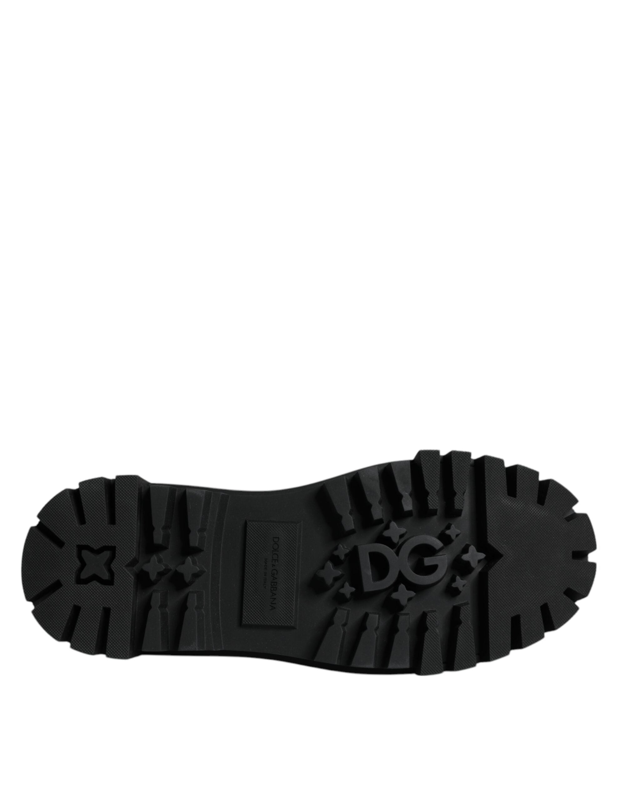 Black leather lace-up trekking dress shoes by Dolce & Gabbana, featuring sturdy soles and classic design.