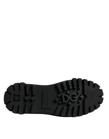 Black leather lace-up trekking dress shoes by Dolce & Gabbana, featuring sturdy soles and classic design.