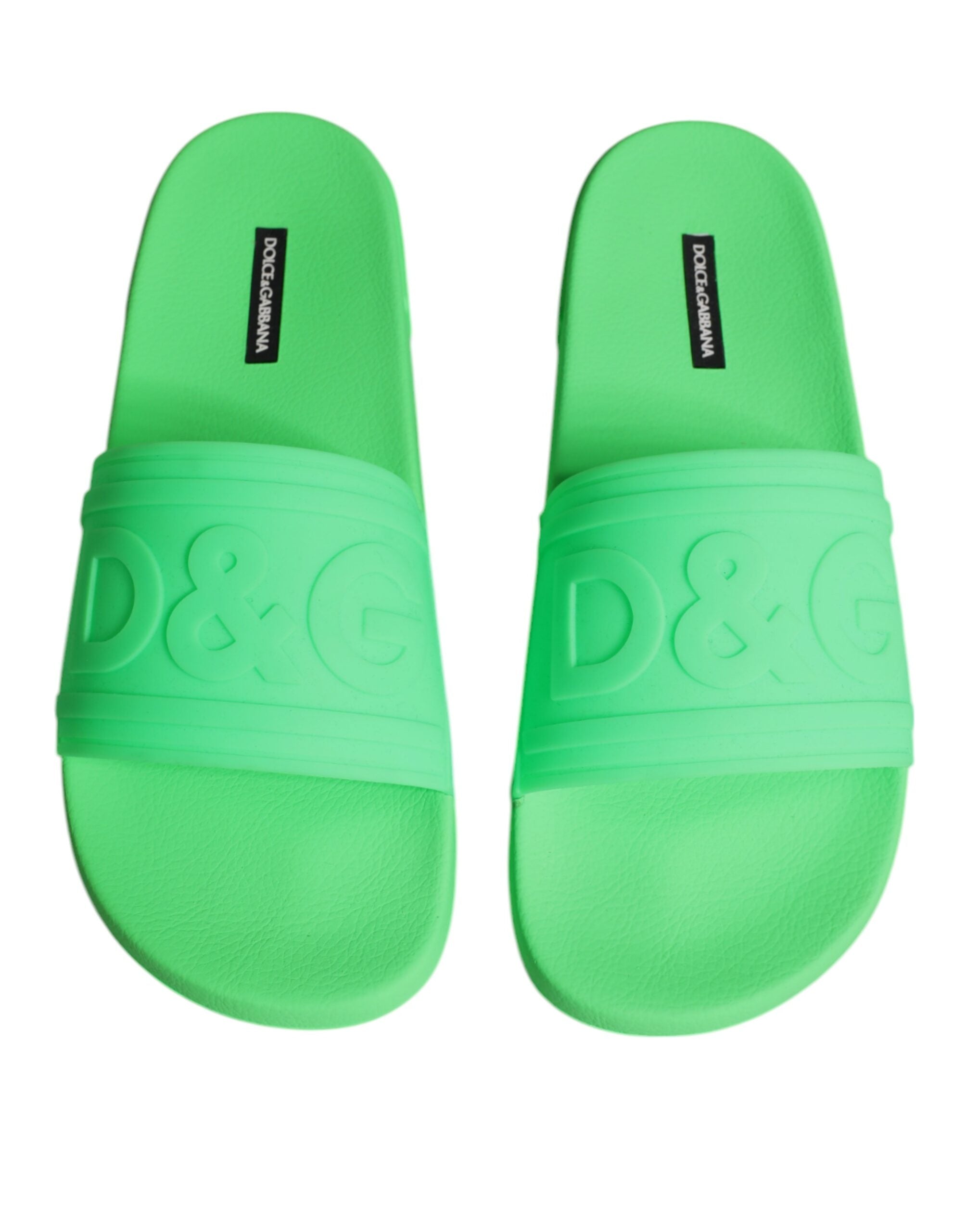 Green leather slides sandals by Dolce & Gabbana, showcasing casual beachwear shoes with open-toe design and slip-on style.