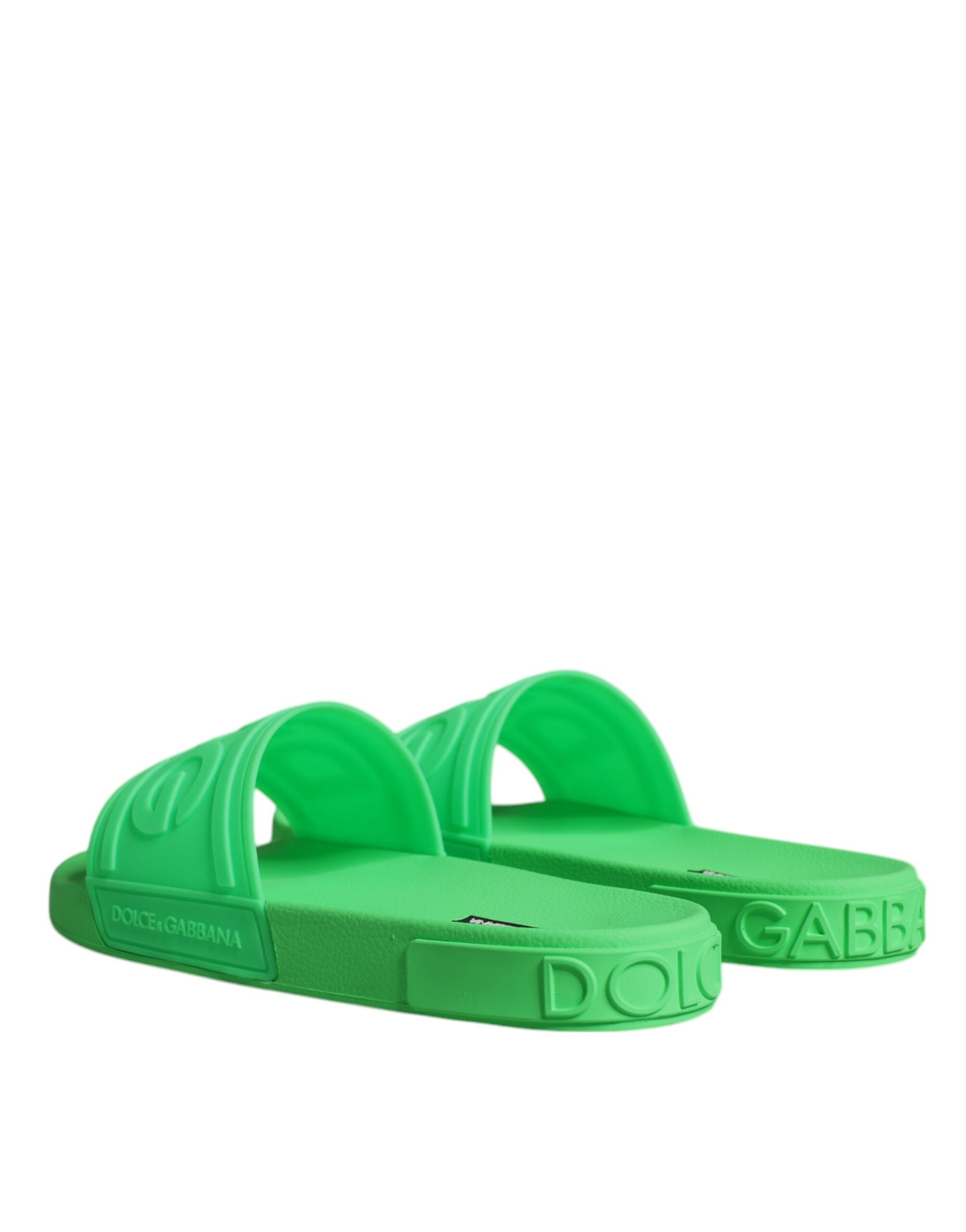 Green leather slides sandals by Dolce & Gabbana with open toes and slip-on design, perfect for beachwear and casual summer wear.