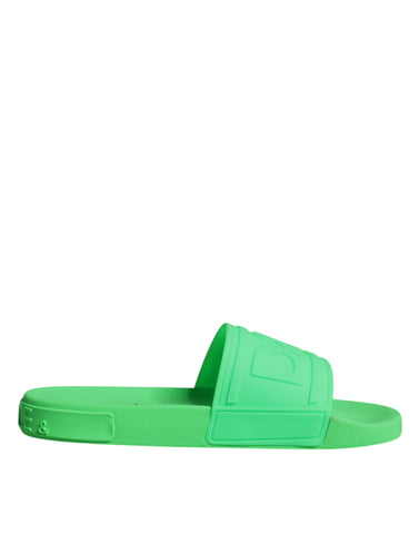 Green leather slides sandals by Dolce & Gabbana, stylish beachwear shoes with open-toe design and casual slip-on style.