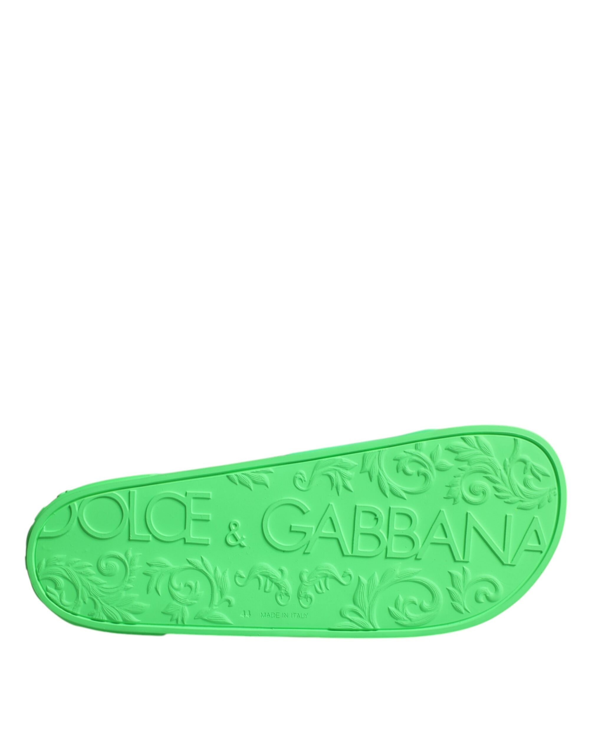 Green leather Dolce & Gabbana slides sandals with open toes, featuring a sleek design perfect for beachwear and casual summer outings.