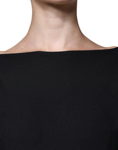 Black viscose cut-out A-line mini dress with long sleeves by Dolce & Gabbana, showcasing a stylish and elegant design.