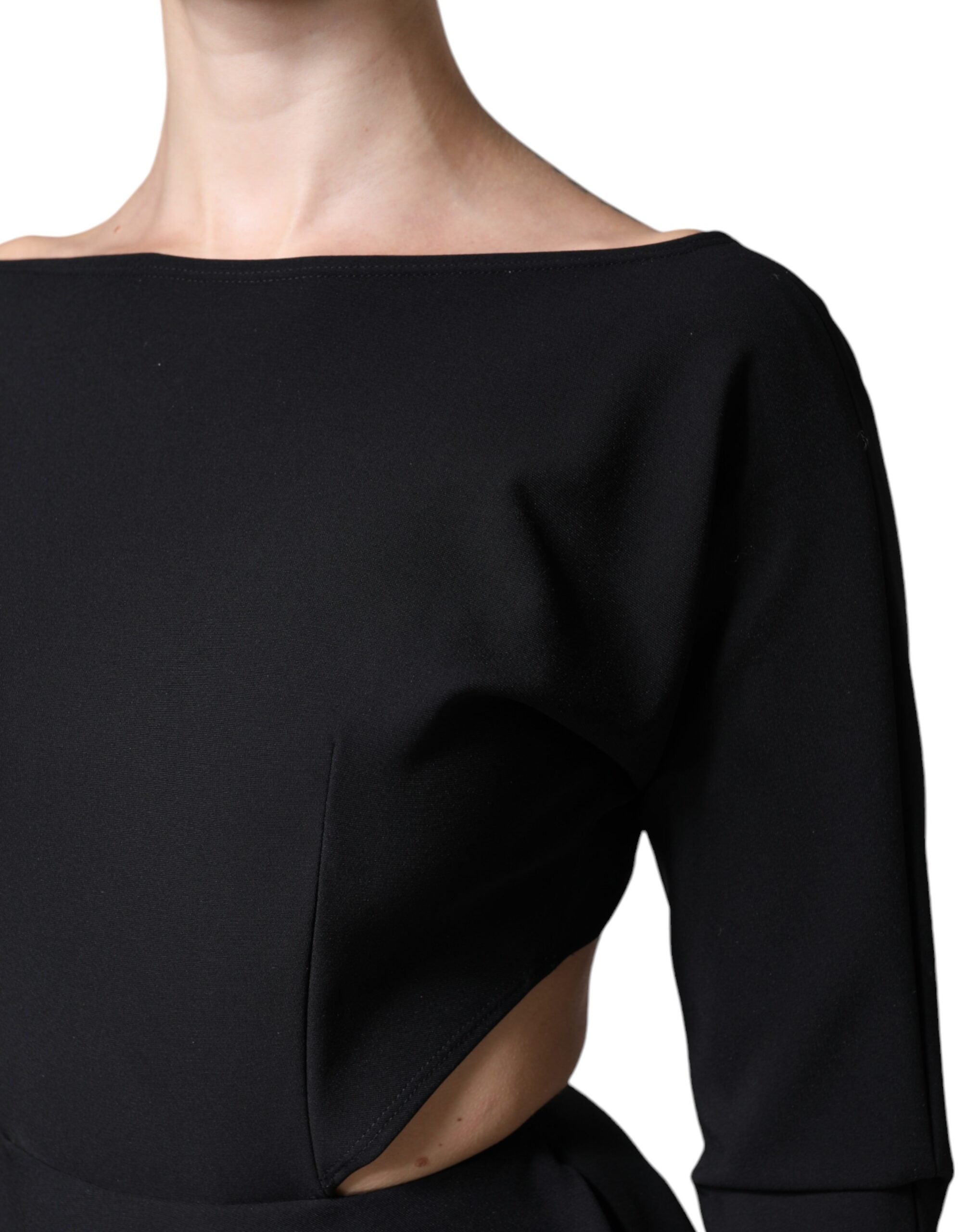 Black viscose cut-out A-line mini dress with long sleeves by Dolce & Gabbana, shown on a model.