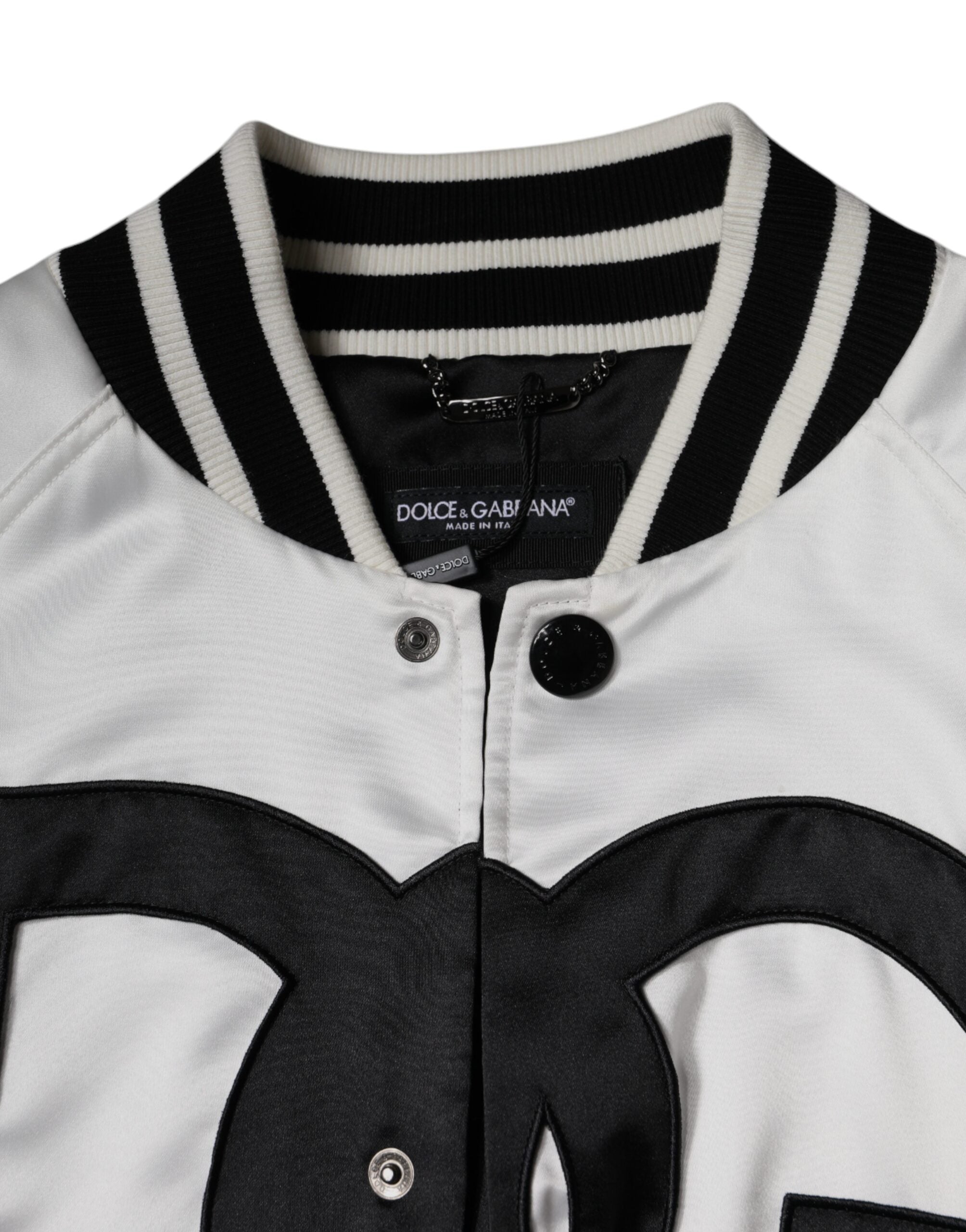 White polyester Dolce & Gabbana logo full-zip bomber jacket with ribbed cuffs and collar, front zipper closure, and sleek design.