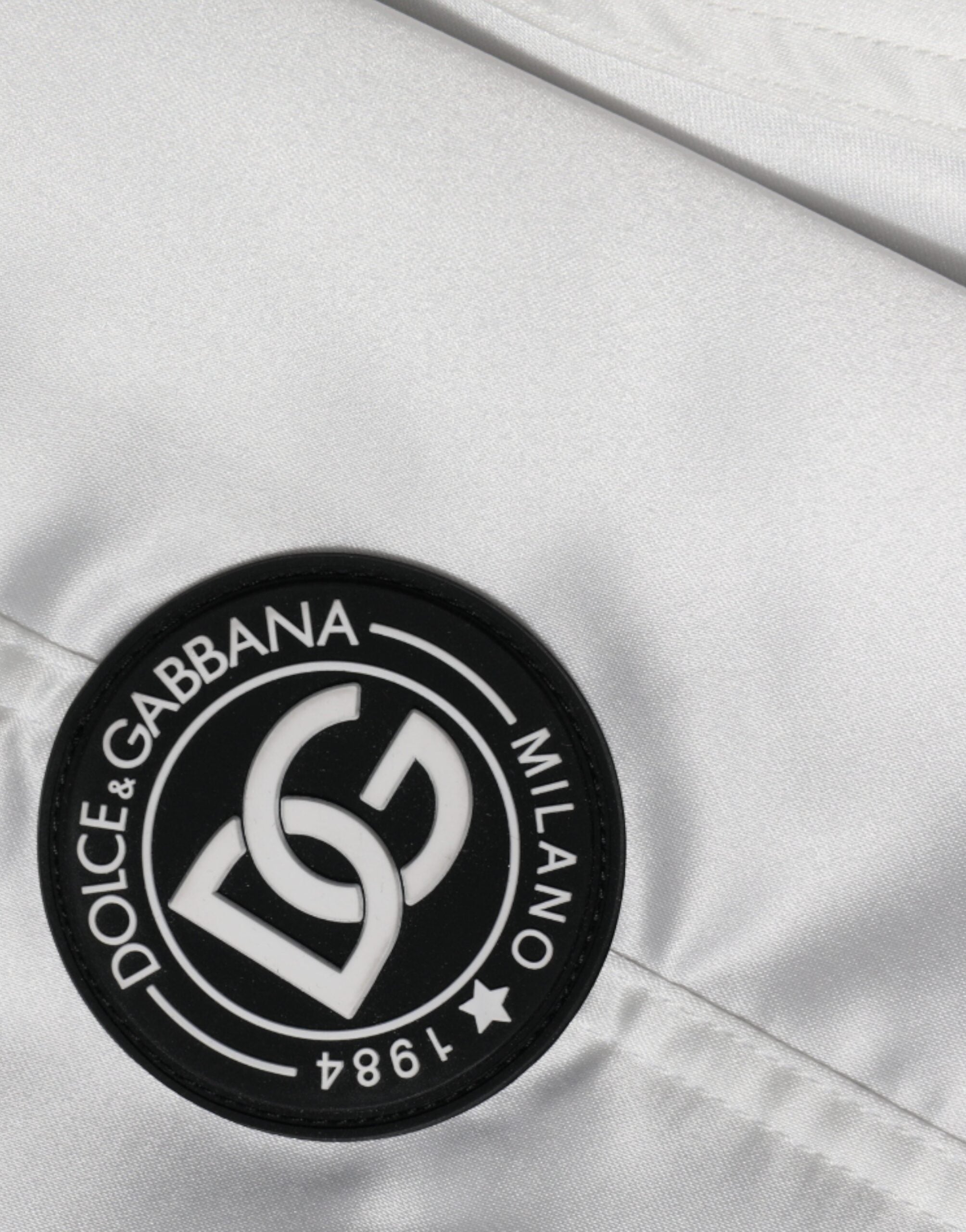 White polyester logo full zip bomber jacket by Dolce & Gabbana, featuring a sleek design with branding on the front.