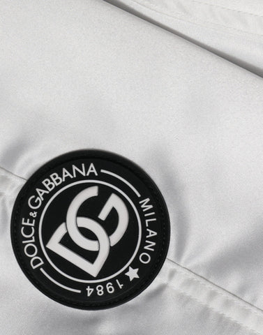 White polyester logo full zip bomber jacket by Dolce & Gabbana, featuring a sleek design with branding on the front.