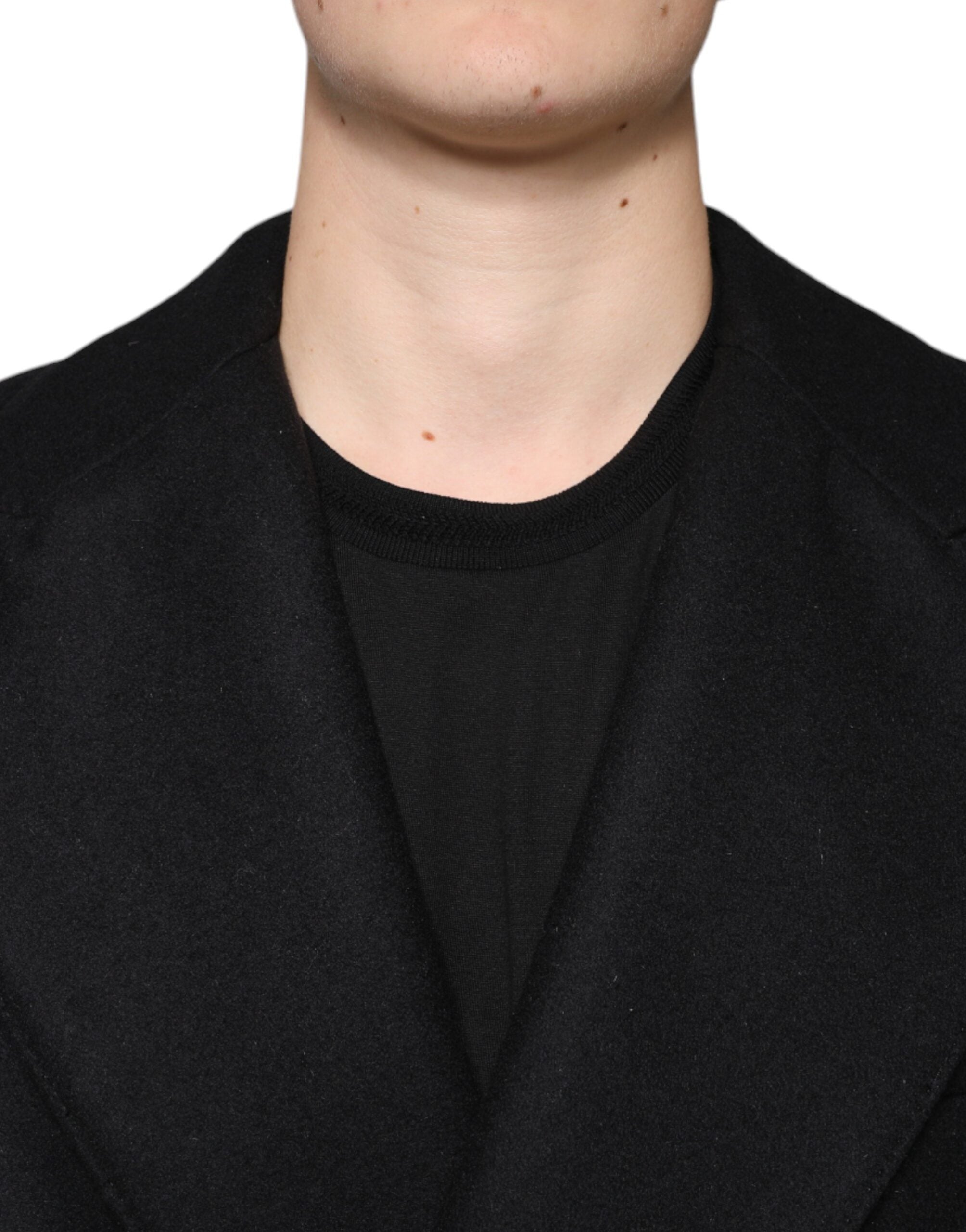 Black wool double-breasted men's coat jacket by Dolce & Gabbana, featuring classic lapels and button details.